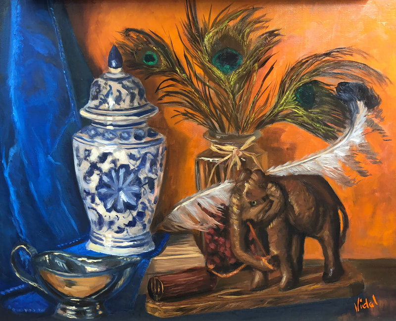 Wooden elephant, Lyrebird and peacock feathers - still life